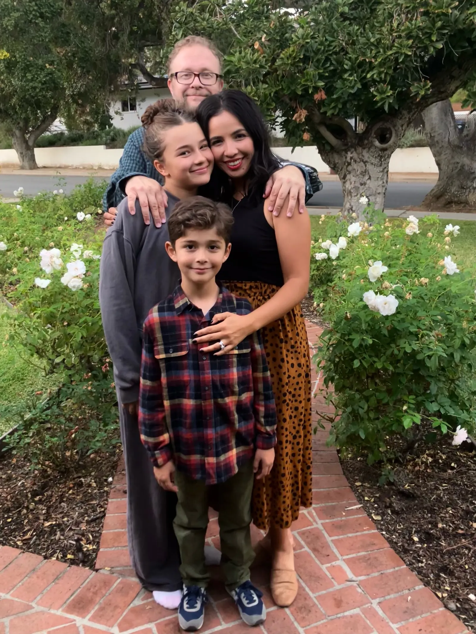 Claire Scotti with her family in a garden